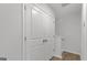 Hallway with a storage closet, railing and stairs at 7234 Crestside Dr # 81, Austell, GA 30168