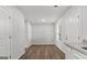 Bright living room with wood-look flooring and natural light streaming through a window at 7234 Crestside Dr # 81, Austell, GA 30168
