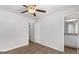 Bedroom with ceiling fan leads to a bathroom with a granite countertop at 7236 Crestside Dr # 80, Austell, GA 30168