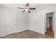 Bedroom with wood-look flooring features a ceiling fan and neutral wall color at 7236 Crestside Dr # 80, Austell, GA 30168