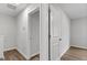 Second floor hall leading to bedrooms with natural lighting at 7236 Crestside Dr # 80, Austell, GA 30168