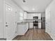 Modern kitchen with stainless steel appliances, granite countertops, and white cabinets at 7236 Crestside Dr # 80, Austell, GA 30168