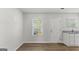 Bright kitchen featuring hardwood floors, white cabinets, and stainless steel appliances at 7236 Crestside Dr # 80, Austell, GA 30168