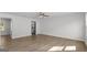 Open floor plan with stainless steel appliances and hardwood floors in a neutral color palette at 7236 Crestside Dr # 80, Austell, GA 30168