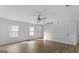 Inviting living room with hardwood floors and neutral walls, with a glimpse of the staircase at 7236 Crestside Dr # 80, Austell, GA 30168