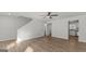 Spacious living room with hardwood floors, ceiling fan, and access to other rooms in the house at 7236 Crestside Dr # 80, Austell, GA 30168