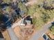 Aerial view of a home showing the driveway, mature trees, and surrounding neighborhood at 201 Lanyard Loop, Peachtree City, GA 30269