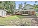 Spacious backyard with a deck, shed, and lush greenery at 201 Lanyard Loop, Peachtree City, GA 30269