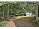 Backyard featuring a storage shed and mature trees at 201 Lanyard Loop, Peachtree City, GA 30269