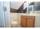 Bathroom featuring wood vanity, modern fixtures, neutral paint, and ceramic tile flooring at 201 Lanyard Loop, Peachtree City, GA 30269