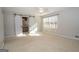 Bright bedroom with natural light and a view into the connected bathroom through barn doors at 201 Lanyard Loop, Peachtree City, GA 30269