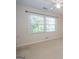 Empty bedroom showcasing natural light and neutral carpet at 201 Lanyard Loop, Peachtree City, GA 30269