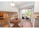 The breakfast nook features a dining table and a sliding door with access to a deck at 201 Lanyard Loop, Peachtree City, GA 30269