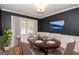 Elegant dining room featuring a hardwood floors, stylish lighting, and a table set for a delightful meal at 201 Lanyard Loop, Peachtree City, GA 30269