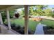 Beautiful front yard view from the porch, showcasing lush green grass, trees, and an adorable deer roaming freely at 201 Lanyard Loop, Peachtree City, GA 30269