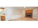 Cozy living room featuring a brick fireplace, built-in shelving, and neutral tones at 201 Lanyard Loop, Peachtree City, GA 30269