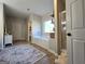 Bathroom featuring a soaking tub, separate shower, shelves with decor, and door to the bedroom at 34 Brittany Way, Palmetto, GA 30268