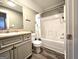 Bathroom with a vanity, a framed mirror, and a shower tub combo at 34 Brittany Way, Palmetto, GA 30268