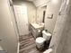 Bathroom featuring a single vanity, a framed mirror, and wood look floors at 34 Brittany Way, Palmetto, GA 30268