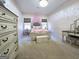 bedroom with decorative furniture, two windows, and neutral carpet at 34 Brittany Way, Palmetto, GA 30268