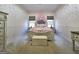 bedroom features decorative bedframe, two windows, and neutral carpet at 34 Brittany Way, Palmetto, GA 30268