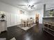 Well-lit dining room with modern décor, including board and batten walls, adjacent to a pantry at 34 Brittany Way, Palmetto, GA 30268