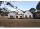 Charming front exterior of a home with a manicured lawn, decorative shutters, and a welcoming front porch at 34 Brittany Way, Palmetto, GA 30268