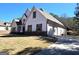 Charming home featuring a well-manicured lawn, two-car garage, and classic architectural details at 34 Brittany Way, Palmetto, GA 30268