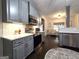 Stylish kitchen with gray cabinets, stainless steel appliances, and under-cabinet lighting at 34 Brittany Way, Palmetto, GA 30268