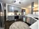Spacious gray kitchen featuring stainless steel appliances, white countertops, and a central island at 34 Brittany Way, Palmetto, GA 30268