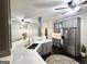 Bright, updated kitchen with quartz countertops, stainless steel appliances, and gray cabinets at 34 Brittany Way, Palmetto, GA 30268