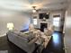 Comfortable living room with a fireplace, television, and plush seating, perfect for relaxation at 34 Brittany Way, Palmetto, GA 30268