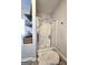 Bathroom featuring a glass-enclosed shower, shelves with decor, and a decorative rug at 34 Brittany Way, Palmetto, GA 30268