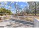 Wooden back deck offering a serene view of the expansive backyard at 5211 Old Monticello Se St, Covington, GA 30014