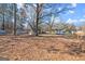 Spacious backyard with ample room for recreation, featuring storage shed at 5211 Old Monticello Se St, Covington, GA 30014