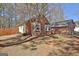 Brick home showing the side yard with a wood fence and a partial view of the attached garage at 300 Planceer Pl, Peachtree City, GA 30269