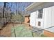 Fenced backyard with a wooden bench and a backdoor, offering a secure and private outdoor space at 940 New Hope Rd, Fayetteville, GA 30214