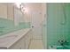 Well-lit bathroom featuring a vanity, mirror, and fixtures at 940 New Hope Rd, Fayetteville, GA 30214