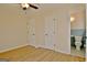 Bedroom with wood floors, two closets, a window, and a partial view of the bathroom at 940 New Hope Rd, Fayetteville, GA 30214