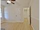 Bright bedroom with wood-look flooring, closet, and access to a full hall bathroom at 940 New Hope Rd, Fayetteville, GA 30214