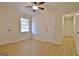 Bright bedroom features a ceiling fan and hardwood floors at 940 New Hope Rd, Fayetteville, GA 30214