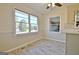 Bright dining area featuring a kitchen view, large windows and sleek floors at 940 New Hope Rd, Fayetteville, GA 30214