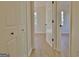 Hallway view highlighting light wood flooring and access to rooms with natural light through large windows at 940 New Hope Rd, Fayetteville, GA 30214