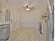 Spacious eat-in kitchen with stainless appliances, modern cabinets, and luxury vinyl tile flooring throughout at 940 New Hope Rd, Fayetteville, GA 30214