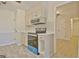 Well-appointed kitchen features stainless appliances, quartz counters and ample cabinet storage at 940 New Hope Rd, Fayetteville, GA 30214
