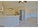 Modern kitchen with stainless steel appliances and breakfast bar seating, open to the dining area at 940 New Hope Rd, Fayetteville, GA 30214