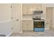 Modern kitchen features new stainless appliances, quartz counters and plentiful cabinet storage at 940 New Hope Rd, Fayetteville, GA 30214