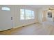 Bright living room featuring sleek flooring and a view of adjacent dining and kitchen area at 940 New Hope Rd, Fayetteville, GA 30214