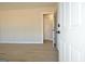 Inviting living room featuring sleek flooring and a doorway to adjacent room at 940 New Hope Rd, Fayetteville, GA 30214