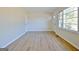 Sunny living room with large windows and sleek floors at 940 New Hope Rd, Fayetteville, GA 30214